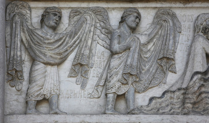 Fototapeta na wymiar Archangels Raphael and Gabriel, detail of marble carvings on the Baptistery, Parma Emilia-Romagna Italy