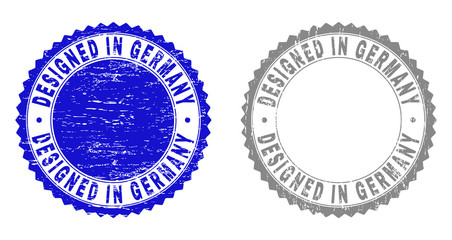 Grunge DESIGNED IN GERMANY stamp seals isolated on a white background. Rosette seals with grunge texture in blue and grey colors.