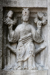 Fototapeta na wymiar Relief at the baptistry from Parma, Emilia Romagna, Italy