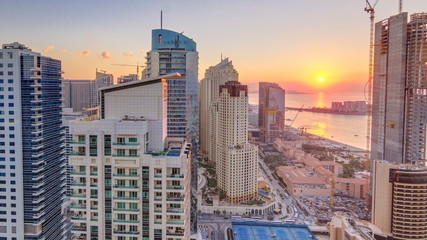 JBR and Dubai marina at sunset aerial timelapse