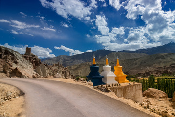 Three colourful buddhist religious stupas