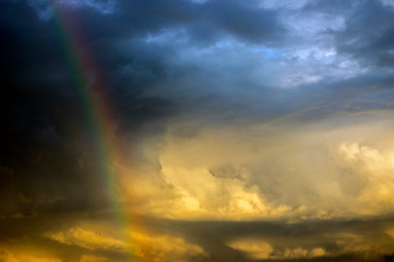 Fototapeta na wymiar rainbow in the middle of a storm...