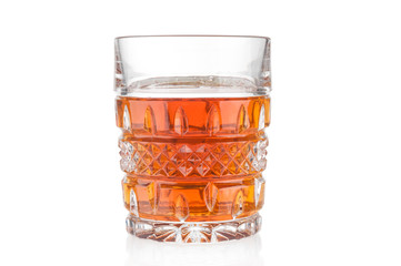 Cognac crystal glass close up on white background