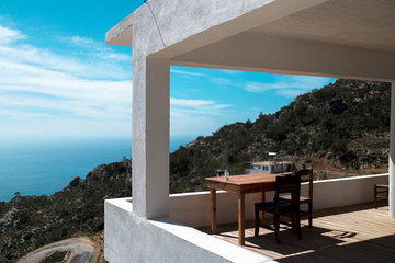 table and chairs on the beach, tourist in the mountains, panoramic landscape of the Turkish mountains and the sea