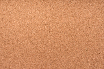 Brown textured cork board closeup for notes