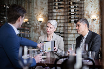 Business executives having a working lunch in a restaurant
