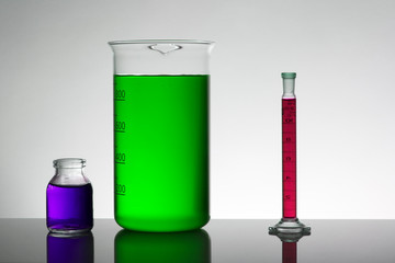 Liquid in laboratory bottles. Scientific biochemical laboratory. Colorful liquid.