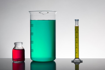 Liquid in laboratory bottles. Scientific biochemical laboratory. Colorful liquid.