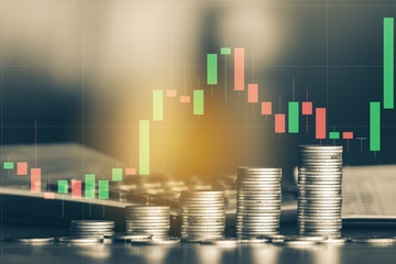 Stock market or forex trading graph with stack of money coin ,financial investment concept use for background