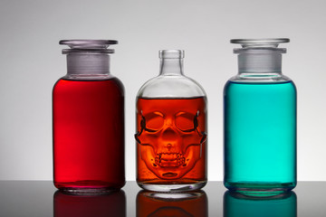 Liquid in laboratory bottles. Scientific biochemical laboratory. Colorful liquid.