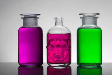 Liquid in laboratory bottles. Scientific biochemical laboratory. Colorful liquid.