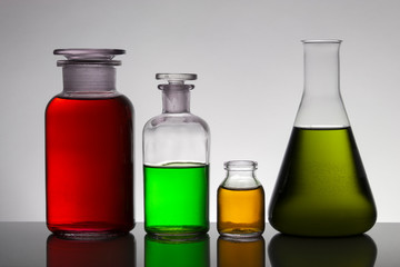 Liquid in laboratory bottles. Scientific biochemical laboratory. Colorful liquid.