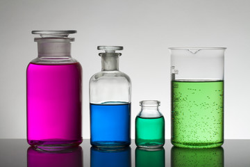 Liquid in laboratory bottles. Scientific biochemical laboratory. Colorful liquid.