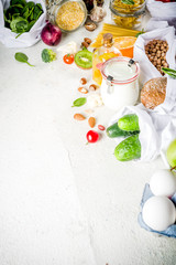 Zero waste shopping and sustanable lifestyle concept, various farm organic vegetables, grains, pasta, eggs and fruits in reusable packaging supermarket bags. copy space top view, banner