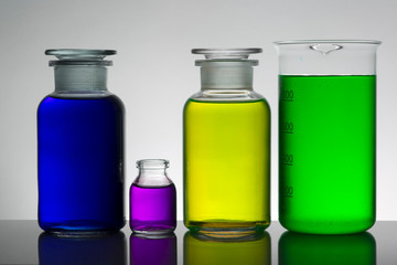 Liquid in laboratory bottles. Scientific biochemical laboratory. Colorful liquid.