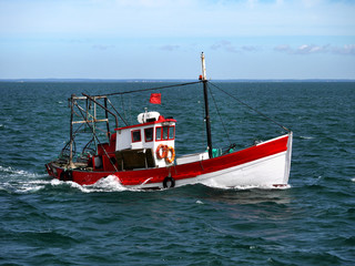 Portuguese fishing boat underway off the coast.