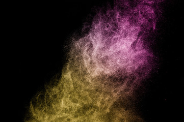 gold and purple powder effect splash for makeup artist or graphic design in black background