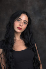 Young beautiful girl on a dark background