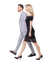 Side view of two walking business people.