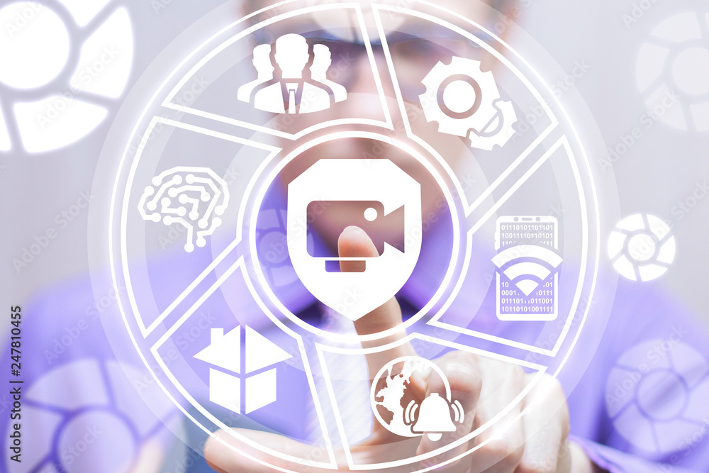 Poster man working on a virtual screen of the future and touches the icon: shield with security camera. vid