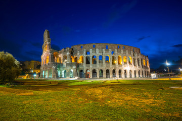 Fototapeta na wymiar The Colosseum illuminated at night in Rome, Italy