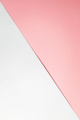 Abstract background: white and pink sheets of paper