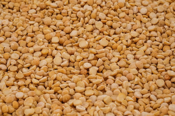 Dry yellow split peas background texture