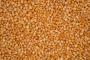 Dry yellow split peas background texture