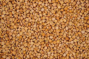 Dry yellow split peas background texture
