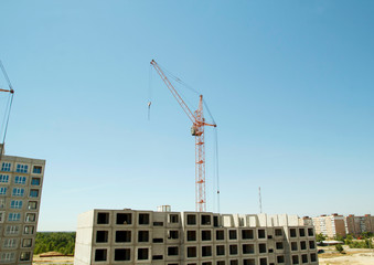 Fototapeta na wymiar Constructions cranes near building. Construction site with crane and building.
