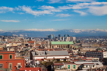 Obraz premium Landscape of city Naples with blue sky and mountains, Italy