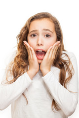 Fototapeta premium Surprised and horrified young girl looking at camera with eyes wide-opened isolated on white background