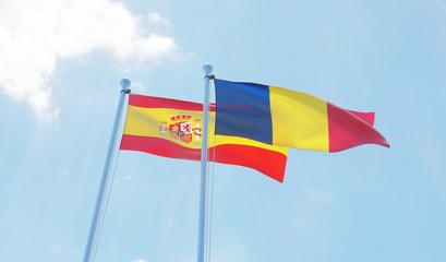 Romania and Spain, two flags waving against blue sky. 3d image