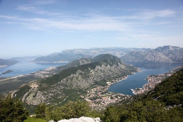 Fototapeta na wymiar Panorama UNESCO World Heritage Site bay of Kotor with high mountains plunge into adriatic sea and Historic town of Kotor, Montenegro