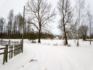 Naklejka premium deep snow covered road in winter