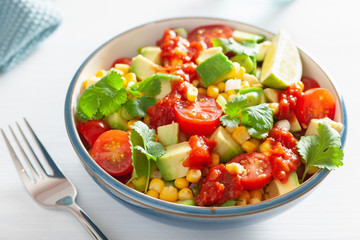 healthy vegan avocado sweetcorn tomato salad