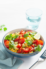 healthy vegan avocado sweetcorn tomato salad