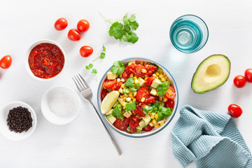 healthy vegan avocado sweetcorn tomato salad