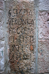 Via Dolorosa, 6th Stations of the Cross. The pilgrims who visit the Holy Land, pass the path that Jesus carried the cross to Calvary. Jerusalem