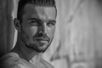 Obraz premium Handsome Caucasian Model Guy Posing on The Beach