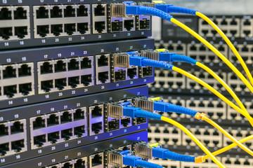 Server communication equipment of the Internet provider. Fiber-optic cables are connected to the...
