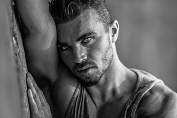 Portrait of a handsome caucasian male model posing on the beach
