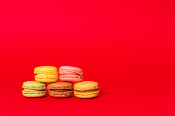 Macarons on red background