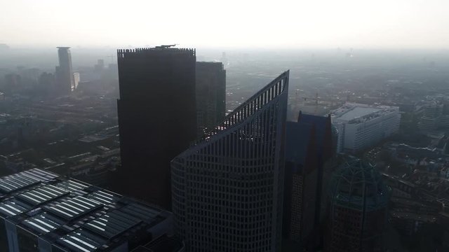 Aerial helicopter view of modern skyscrapers located at downtown The Hague is city on the western coast of the Netherlands and the capital of the province of South Holland 4k high resolution footage