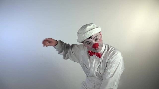 Emoji Clown. An insistent clown indicates with his hand the expulsion of someone three times.