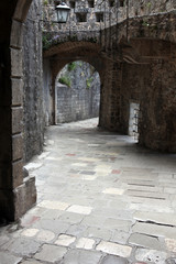 Ancient arch pathway on a Kotor old town in Montenegro