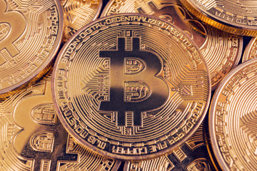 Fototapeta na wymiar Golden Bitcoin coins. New digital and virtual money.