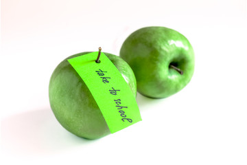 two green apples on white background, child care, spples for school lunch