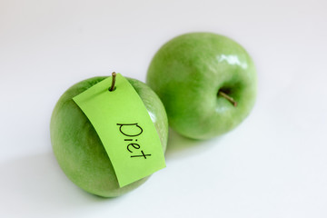 fruits for diet, two green apples, green note, health nutrition