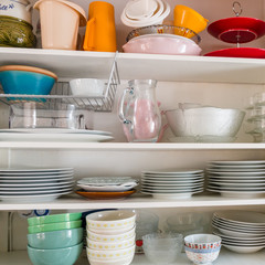 Kitchen storage on shelves in a kitchen cabinet 